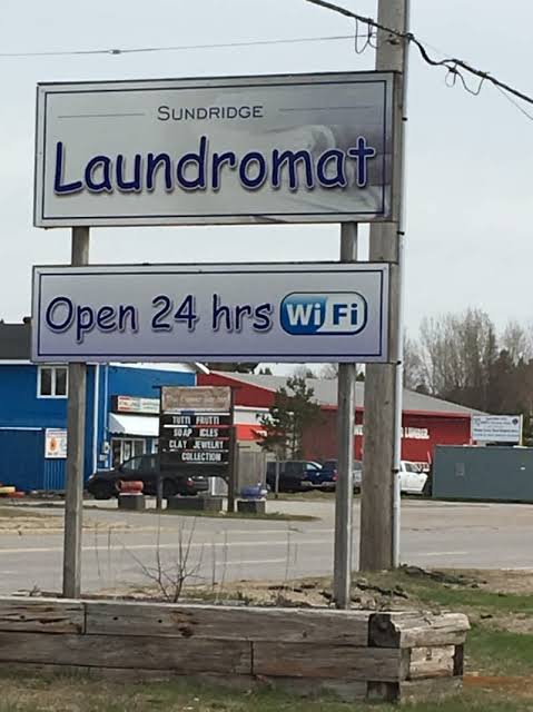 Clean laundromat folding area and laundry machines